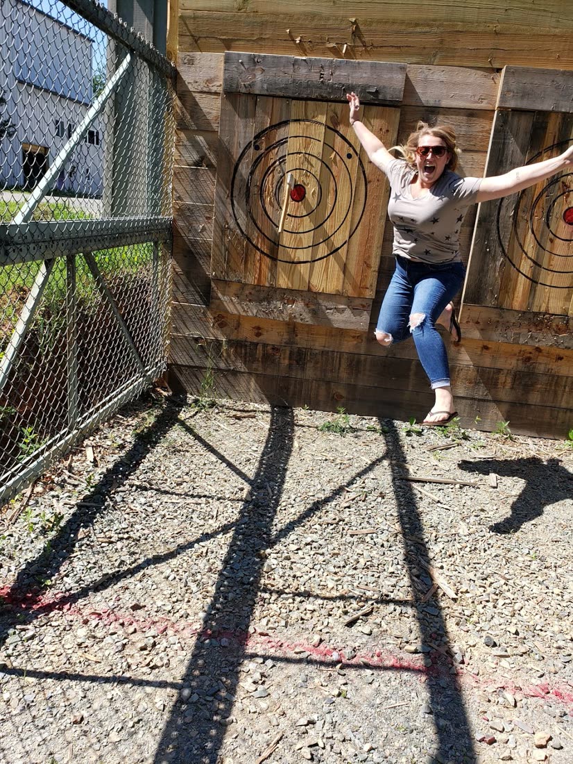 Chatham Axes thrower jumping for joy in front of the target